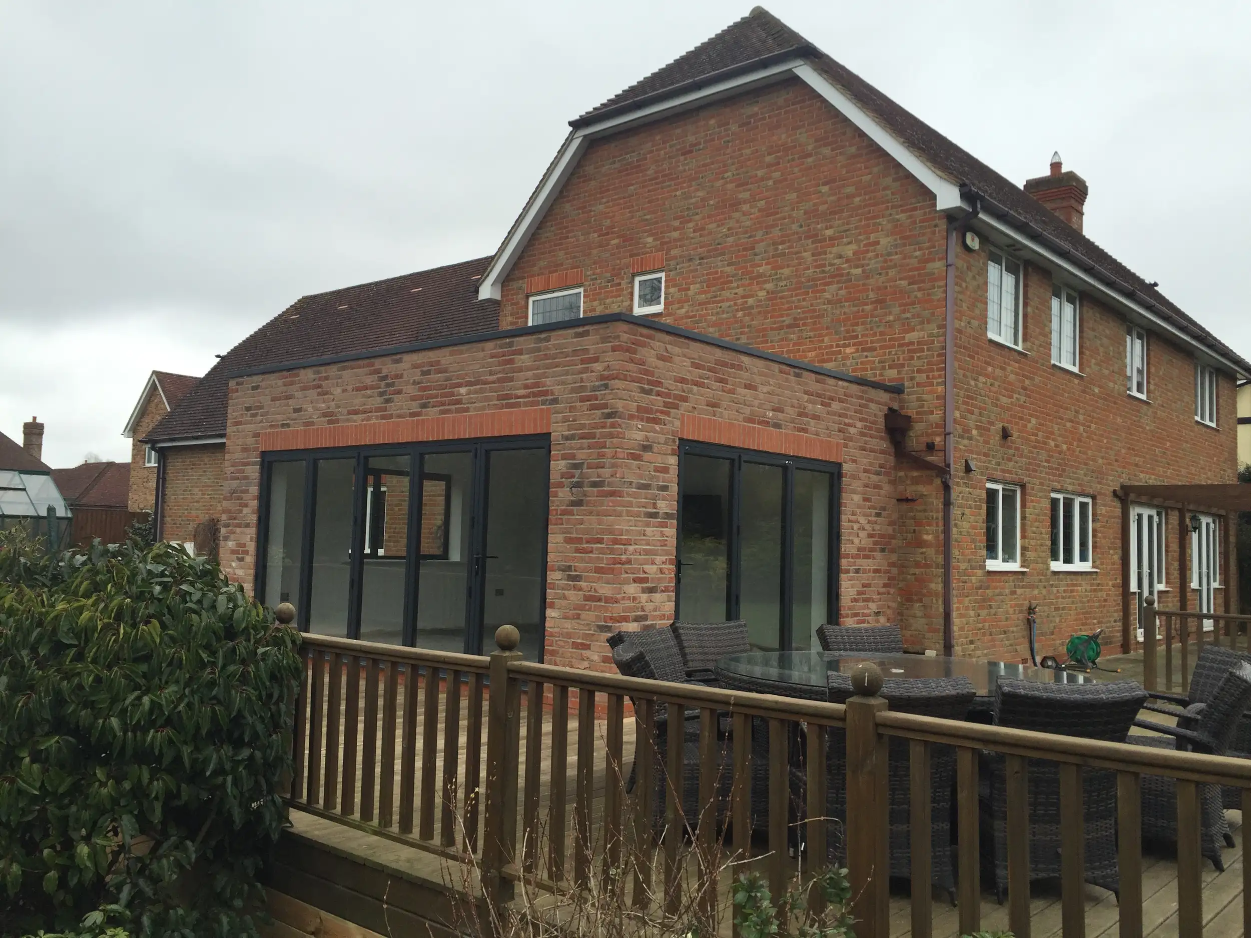Garden room and raised decking to the rear of a home